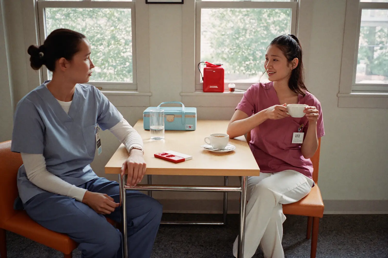 A nurse looking between two different care environments